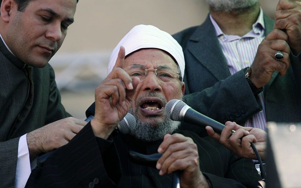 Sheikh Youssef Qaradawi speaks to a crowd in Cairo's Tahrir Square, February 2, 2014 (Khalil Hamra/AP)
