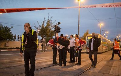 Police and rescue personnel at the scene where a car crashed into a Jerusalem light rail station at Ammunition Hill on October 22, 2014. (Photo credit: Yonatan Sindel/Flash90)