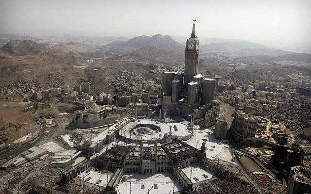 The tallest clock tower in the world at the Abraj al-Bait Towers overlooks the Grand Mosque and its expansion in Mecca, Saudi Arabia, October 16, 2013. (photo credit: AP/Amr Nabil, File)