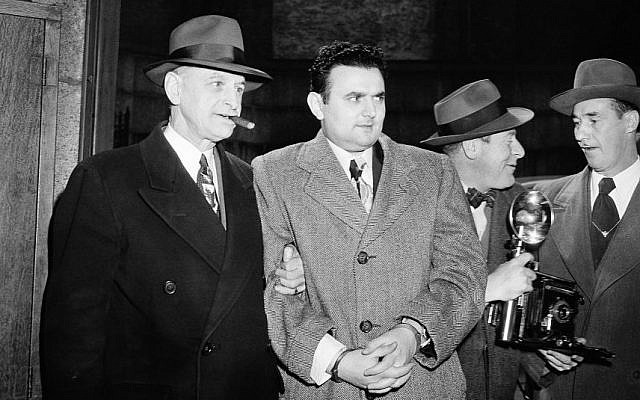 In this April 5, 1951, file photo, David Greenglass, second from left, is led into Federal Courthouse in New York for sentencing as an atom spy. (Photo credit: AP Photo/File)