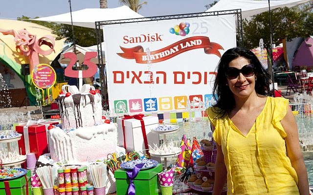 Ronit Karpel, SanDisk's Director of Personnel for Israel and the EMEA region, poses at Israel's Superland amusement park, where the company threw a 25th anniversary party for employees and their families last year (Photo credit: Courtesy)