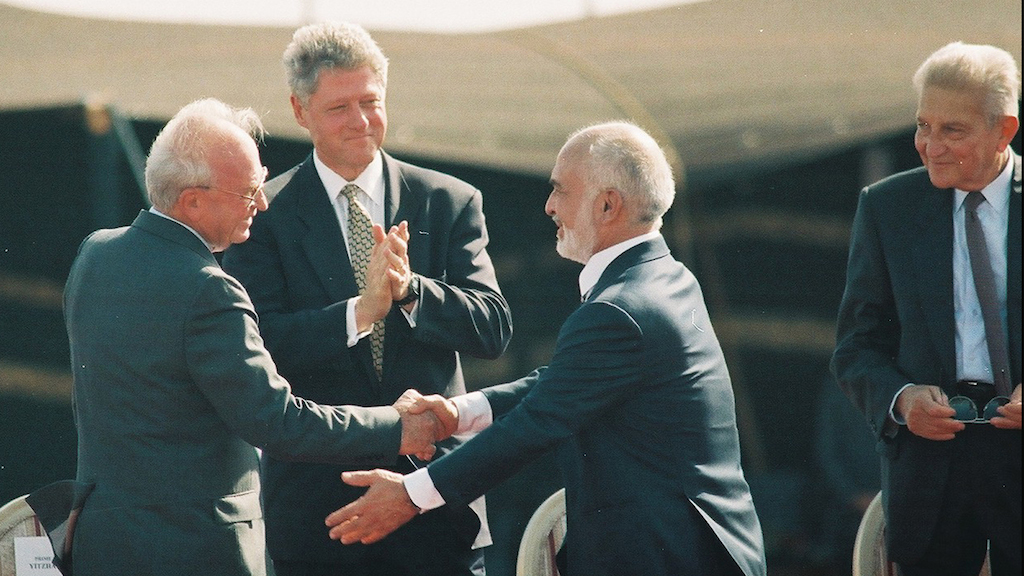 File photo of US President Bill Clinton, Israeli Prime Minister Yitzhak Rabin, King Hussein of Jordan and Israeli President Ezer Weizman at the peace treaty signing ceremony in the Arava Desert, October 1994. (Flash90/Yossi Zamir)