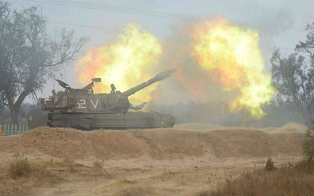 An IDF artillery piece firing toward Gaza during Operation Protective Edge (photo credit: IDF Spokesperson's Unit)