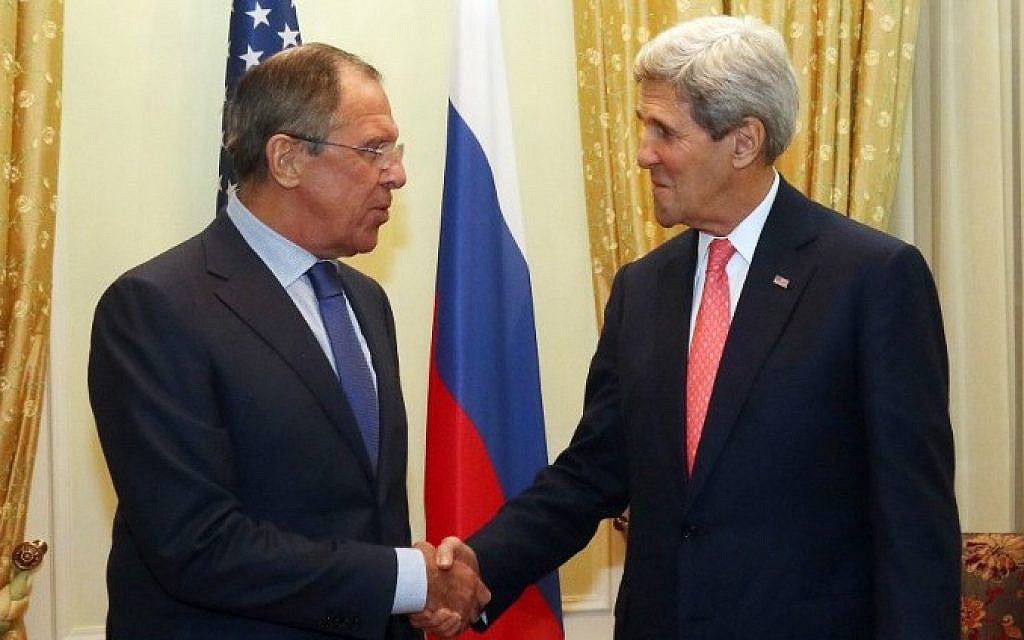 US Secretary of State John Kerry (R) and Russian Foreign Minister Sergei Lavrov shake hands prior to a bilateral meeting on the sidelines of the  nuclear talks with Iran at the Palais Coburg in Vienna on November 23, 2014. (photo credit: AFP/POOL/ RONALD ZAK)