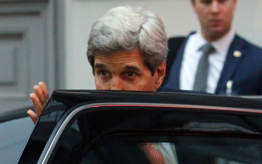 US Secretary of State John Kerry leaves Palais Coburg where closed-door nuclear talks with Iran take place in Vienna, Austria, Friday, Nov. 21, 2014.  (Photo credit: AP/Ronald Zak)