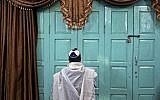 Illustrative: In this photo from November 20, 2014, an Iranian Jewish man prays at the Molla Agha Baba Synagogue, in the city of Yazd 420 miles (676 kilometers) south of capital Tehran, Iran. (AP Photo/Ebrahim Noroozi)