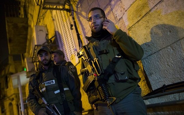 Border Police at the scene of the stabbing on Hanevi'im Street in Jerusalem, November 16, 2014. (photo credit: Yonatan Sindel/Flash90)