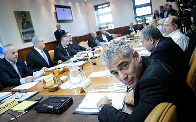 Finance Minister Yair Lapid attends the weekly cabinet meeting at the Prime Minister's Office in Jerusalem on November 30, 2014. (photo credit: Alex Kolomoisky/POOL/FLASH90)