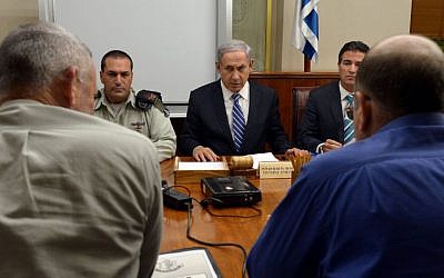 Benjamin Netanyahu, center, meeting with security officials in Jerusalem on November 10, 2014. (photo credit: Haim Zach/GPO)