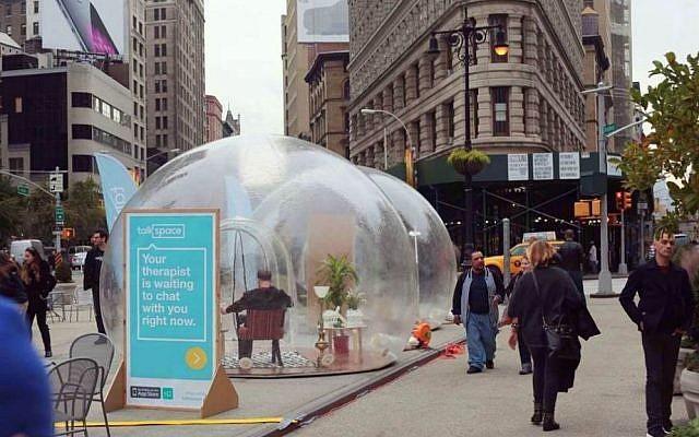 New York residents stroll past large transparent bubbles planted in Manhattan's Fifth Avenue by Israeli start up, Talkspace. November 12, 2014. (photo credit: courtesy)