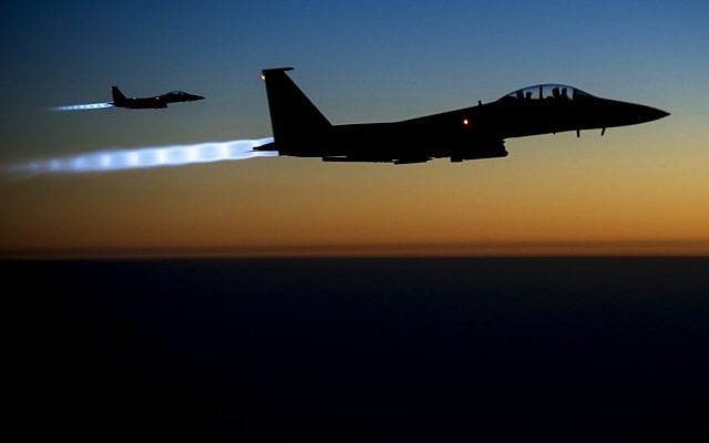 A pair of US Air Force F-15E Strike Eagles fly over northern Iraq after conducting airstrikes against Islamic State targets in Syria on Sept. 23, 2014. (US Air Force/Senior Airman Matthew Bruch)