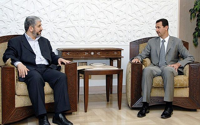 In this picture released by the Syrian national news agency SANA, Syrian President Bashar Assad, right, meets then-Hamas political chief Khaled Mashaal in Damascus, July 3, 2008 (photo credit: AP)