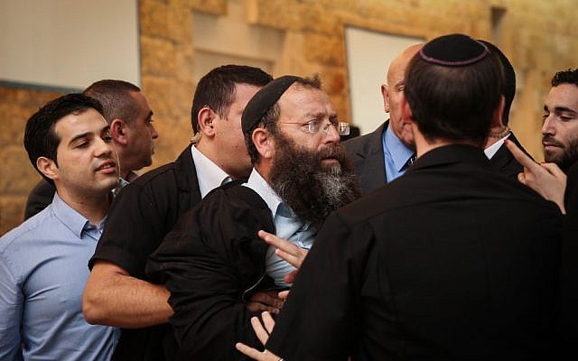 Right wing activist Baruch Marzel clashes with Arab MK's and court security following a court hearing on MK Hanin Zoabi, December 9, 2014 (photo credit: Hadas Parush/Flash90)