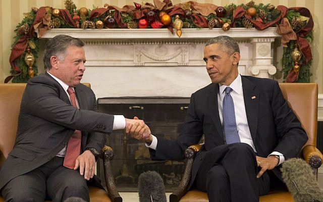 President Barack Obama shakes hands with Jordan's King Abdullah II during their meeting in the Oval Office of the White House in Washington, Friday, Dec. 5, 2014. (AP Photo/Jacquelyn Martin)