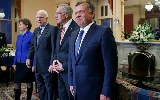 King Abdullah II of Jordan, Senate Majority Leader Harry Reid, Senator John McCain and Senator Jeanne Shaheen gather for a meeting at the Capitol in Washington on December 2, 2014. (photo credit: AP/J. Scott Applewhite)