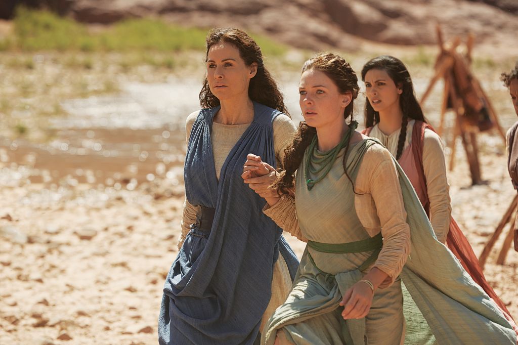 Minnie Driver (Leah), left, holding hands with Rebecca Ferguson (Dinah), with Morena Baccarin (Rachel) behind them, from the Lifetime miniseries 'The Red Tent.' (Joey L./Lifetime/JTA)
