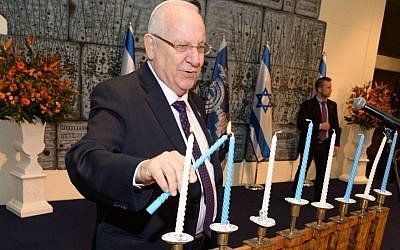 President Rivlin during a Hanukkah candle-lighting ceremony with Holocaust survivors at his residence in Jerusalem, December 22, 2014. (Mark Neyman/GPO/Flash90)