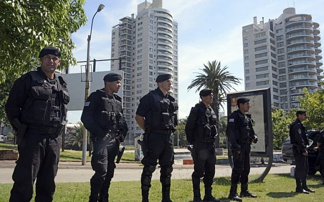 Illustrative photo of security forces standing guard near the World Trade Center Montevideo, which houses offices of the Israeli embassy, on January 8, 2015 (AFP/Mario Goldman)