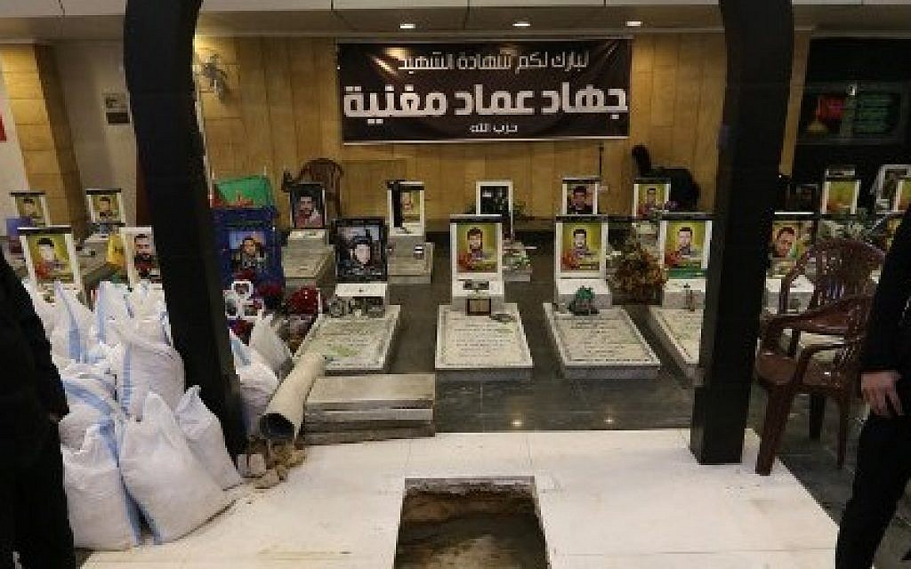 The tomb of Hezbollah member Jihad Imad Mughniyeh is prepared on top of his father's grave at the "Martyr's cemetery" in a southern Beirut suburb on January 19, 2015. photo credit: Joseph Eid/AFP)