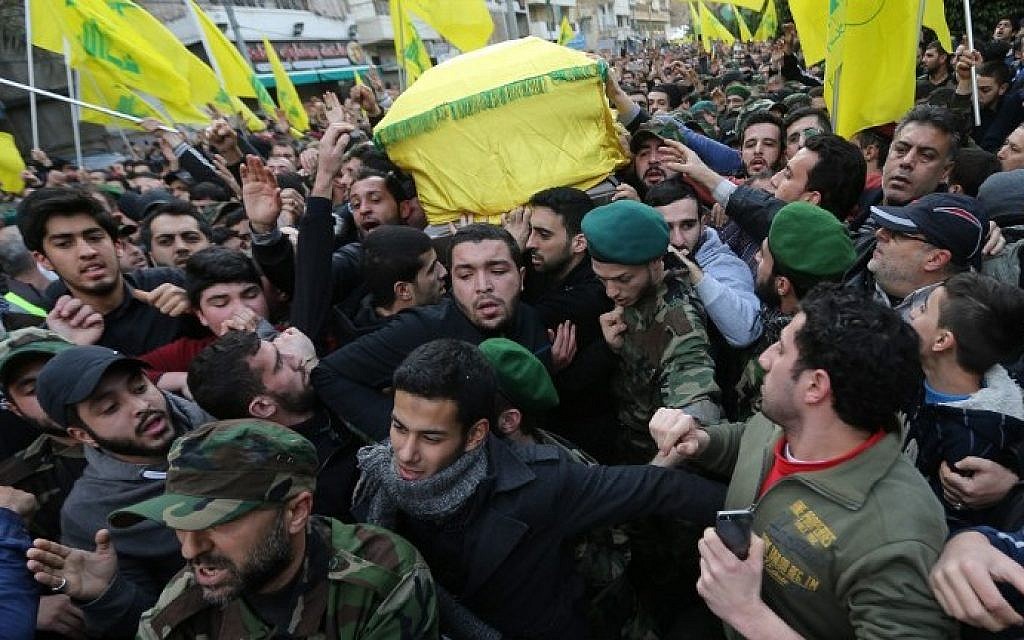 Lebanese Hezbollah supporters carry the coffin of Jihad Mughniyeh, killed in an alleged Israeli airstrike,  during his funeral in a southern Beirut suburb on January 19, 2015. (photo credit: Joseph Eid/AFP)