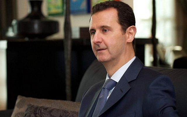 Syrian President Bashar Assad gives an interview to Foreign Affairs magazine in Damascus, January 26, 2015. (AFP)