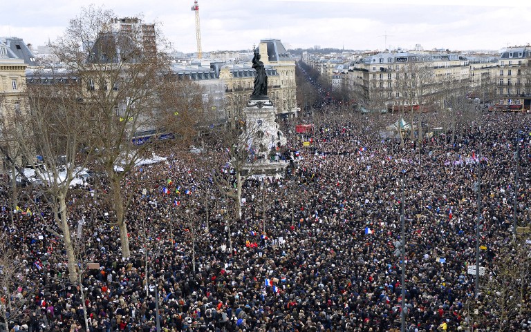 People gather on the Place de la Republique (Republic Square) in Paris before the start of a Unity rally on January 11, 2015, in tribute to the 17 victims of a three-day killing spree by homegrown Islamists (photo credit: AFP/BERTRAND GUAY)
