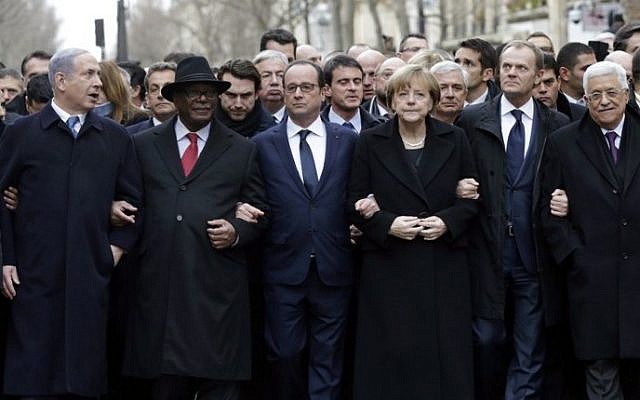 French President Francois Hollande (3rd L) is surrounded by head of states (From L to R : Prime Minister Benyamin Netanyahu, Ibrahim Boubakar Keita of Mali, Chancellor Angela Merkel of Germany, EU Council President Donald Tusk and Palestinian Authority President Mahmoud Abbas) as they attend the solidarity march (Marche Republicaine) in the streets of Paris January 11, 2015. (photo credit: AFP/POOL PHILIPPE WOJAZER)
