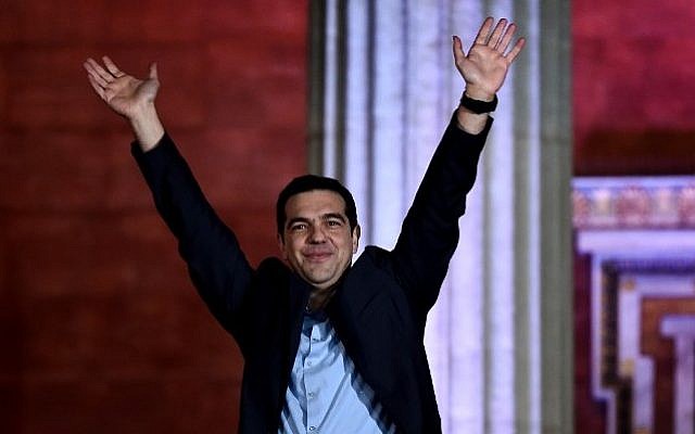 Syriza party leader Alexis Tsipras greets supporters following victory in the election in Athens, Greece, on January 25, 2015. (AFP/Aris Messinis)
