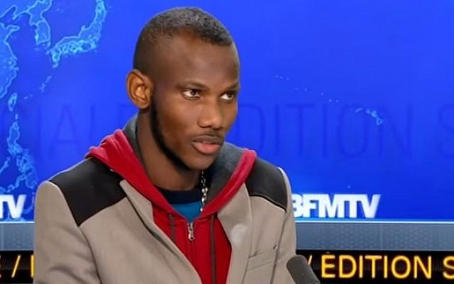 Lassana Bathily appearing on French television news channel BFMTV in the days after the attack on the Hyper Cacher supermarket in Paris on  January 9, 2015. (Screenshot from YouTube)