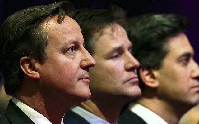 Britain's Prime Minister David Cameron, with Deputy Prime Minister Nick Clegg and Leader of the opposition Labour Party, Ed Miliband, attend a Holocaust Memorial Day ceremony at Central Hall Westminster, Tuesday Jan. 27, 2015, in London. (AP Photo/Chris Jackson, Pool)