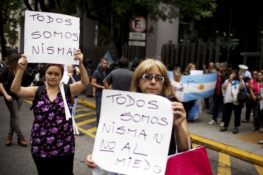 Women protest while holding signs that read in Spanish 'We are all Nisman, No to Fear,' referring to the death of special prosecutor Alberto Nisman, outside Congress in Buenos Aires, Argentina, Monday, Jan. 19, 2015. (photo credit: AP Photo/Rodrigo Abd)