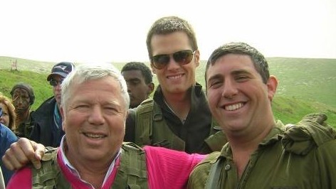 New England Patriots owner Robert Kraft and quarterback Tom Brady visit Nahal Haredi soldier Avi Sandler on his base during a 2006 trip to Israel (photo credit: Courtesy)