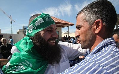 A Hamas prisoner released as part of the Shalit deal embraces his family member in Ramallah, October 18, 2011 (photo credit: Yossi Zamir/Flash90)
