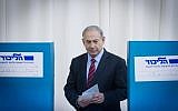 Prime Minister Benjamin Netanyahu casts his vote in the Likud primaries on December 31, 2014. (Miriam Alster/Flash90)