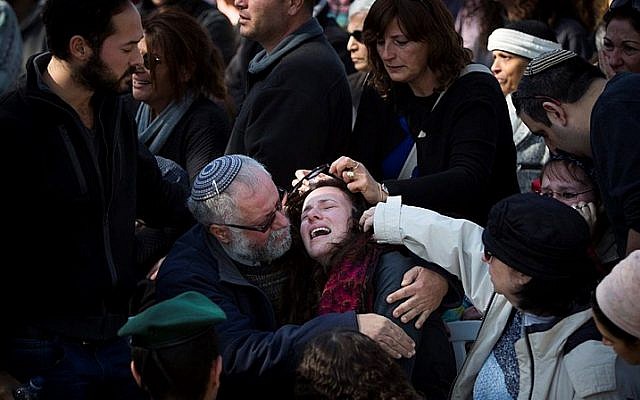 The wife of Cpt. Yohai Kalangel mourning during his funeral at the military cemetery on Mount Herzl, in Jerusalem on January 29, 2015. (photo credit: Yonatan Sindel/Flash90)