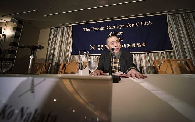 Ko Nakata, an expert on Islamic law, prepares for a press conference at the Foreign Correspondents' Club of Japan in Tokyo regarding the Islamic State, which currently holds two Japanese hostages, Thursday, Jan. 22, 2015. (AP Photo/Eugene Hoshiko)
