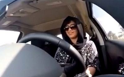 This image made from a video released by Loujain al-Hathloul, shows her driving towards the United Arab Emirates - Saudi Arabia border before her arrest on Dec. 1, 2014. Activists say the kingdom's strict application of Sharia law, including a ban on women driving, is part of an effort to appease the religious conservatives who are vital supporters in the country's fight against Sunni extremists. (Photo credit: AP/Loujain al-Hathloul, File)
