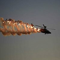 An illustrative photo of an Israel Air Force Apache helicopter, taken on December 25, 2014 at Hatzerim Air Base in Israel ( AP Photo/ Tsafrir Abayov)