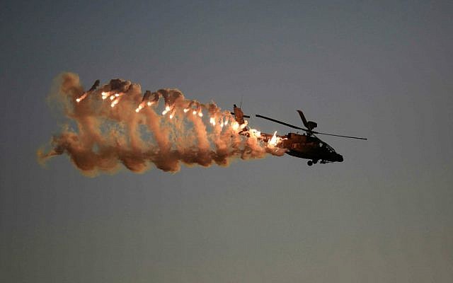 An illustrative photo of an Israel Air Force Apache helicopter, taken on December 25, 2014 at Hatzerim Air Base in Israel (photo credit: AP Photo/ Tsafrir Abayov)
