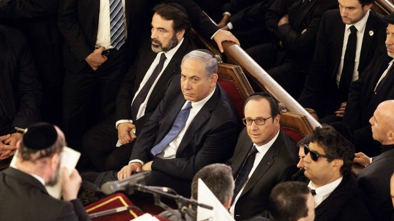 From left, The President of the Central Jewish Consistory of France, Joel Mergui, Israel's Prime Minister Benjamin Netanyahu and French President Francois Hollande attend a ceremony at the Grand Synagogue in Paris, on January 11, 2015 (photo credit: AFP/ POOL / MATTHIEU ALEXANDRE) 