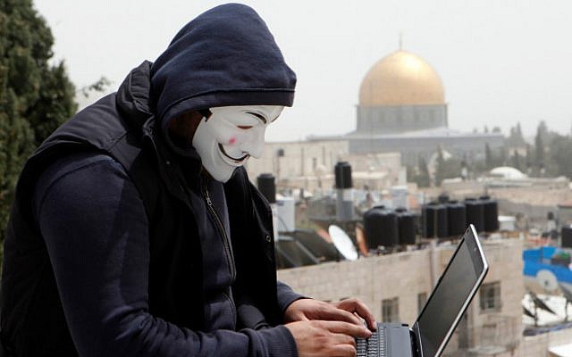 A Palestinian hacker on the backdrop of the Dome of the Rock on April 8, 2013 (photo credit: Sliman Khader/ Flash 90)