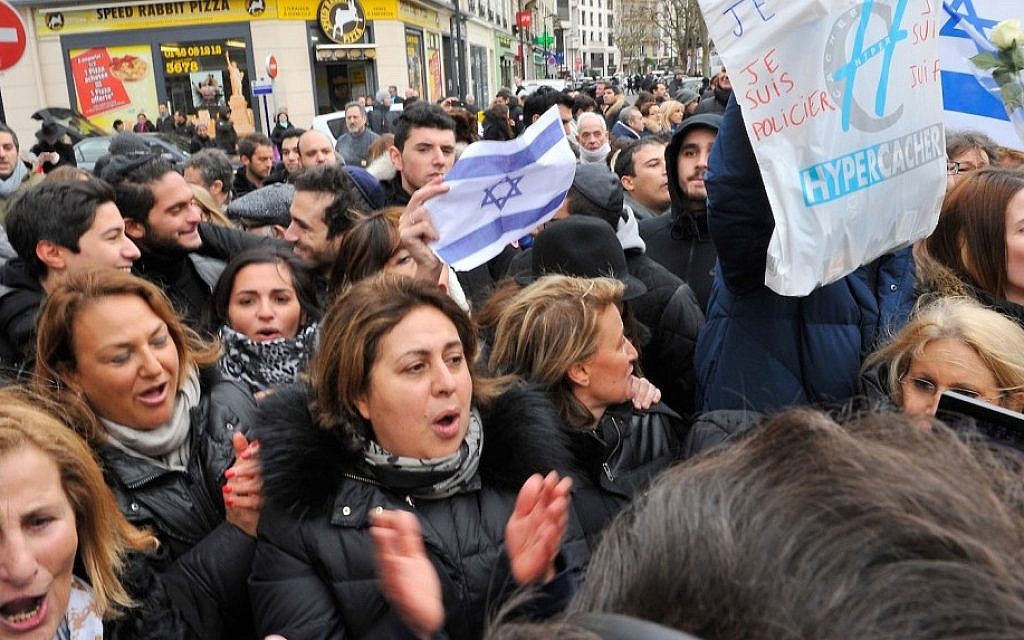 The crowd outside the kosher supermarket Hyper Cacher as Prime Minister Benjamin Netanyahu pays his respect to the victims of last week’s terrorist attacks, Jan. 12, 2015 in Paris (Photo credit: Aurelien Meunier/Getty Images/JTA)