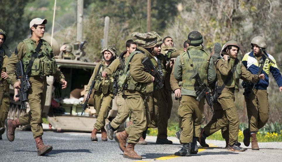 Israeli soldiers seen being taken care of when an Israeli army patrol came under anti-tank fire from Hezbollah operatives in the northern Mount Dov region along the Israeli border with Lebanon on January 28, 2015. (Photo credit: Basal Awidat/Flash90) 