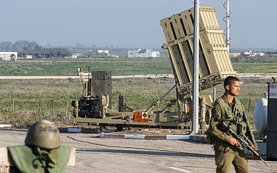 Israeli soldiers patrol near an Iron Dome defense system, designed to intercept and destroy incoming short-range rockets and artillery shells, in the Golan Heights, on January 20, 2015. (AFP/Jack Guez)