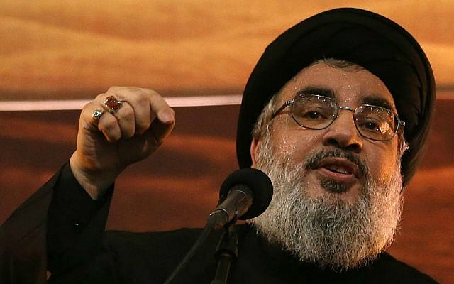 Hezbollah head Hassan Nasrallah speaking in southern Beirut, November 3, 2014. (AP/Hussein Malla)