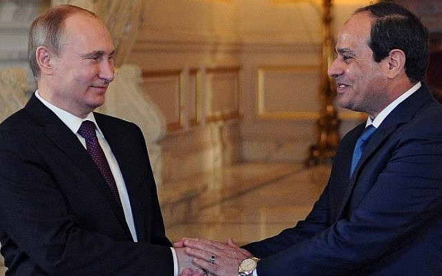 Egyptian President Abdel-Fattah el-Sissi (right) shakes hands with his Russian counterpart Vladimir Putin during their meeting in Cairo on February 10, 2015. (photo credit: AFP/ Ria Novosti/Mikhail Klimentyev)
