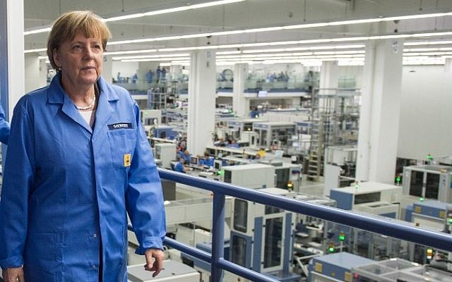German Chancellor Angela Merkel visits a Siemens Industrial electronics factory in Amberg, southern Germany on February 23, 2015. (Armin Weigel/DPA/AFP)