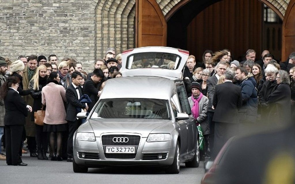 The coffin of Danish filmmaker Finn Noergaard is carried out of the Grundtvigs Kirke church during his funeral ceremony in Copenhagen on Febuary 24, 2015. (photo credit: Niels Ahlmann Olesen/Scanpix Denmark/AFP)