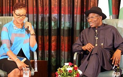 Nigerian President Goodluck Jonathan (right) speaks, flanked by broadcaster and publisher Adesuwa Onyenokwe, during a nationally broadcast interview with journalists in Abuja on February 11, 2015.  (photo credit: AFP/Stringer)