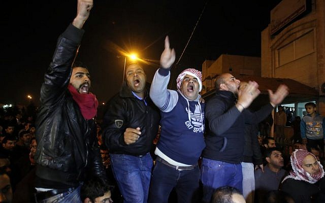 Supporters and family members of Jordanian pilot, Lt. Moaz al-Kasasbeh protest his reported killing in Amman on Feb. 3, 2015. A video released online Tuesday purportedly shows the pilot being burned to death by the Islamic State following a week-long drama over a possible prisoner exchange. (Photo credit: Raad Adayleh/AP)